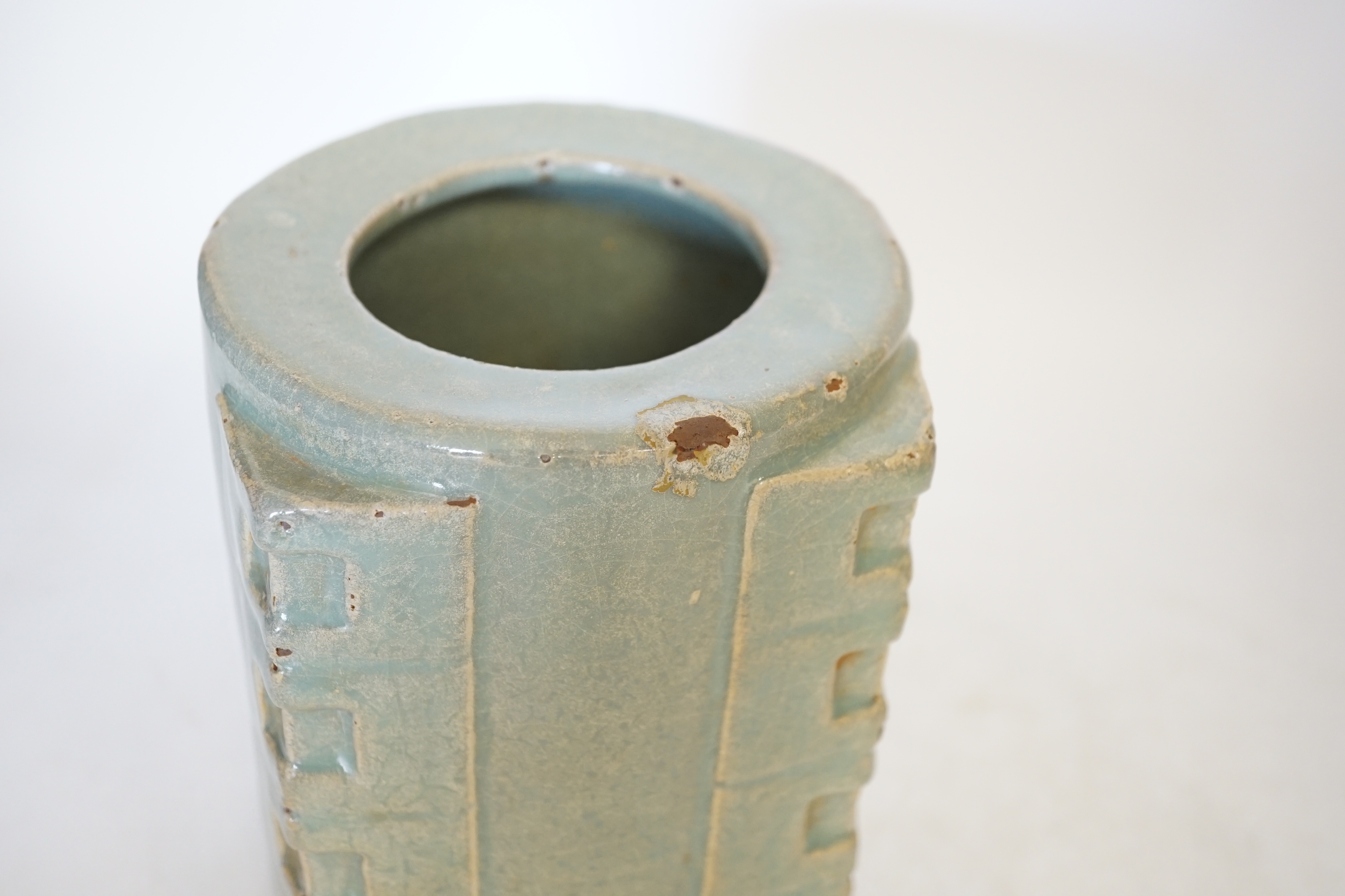 A Chinese celadon glazed cong jar, 18cm high. Condition - poor to fair, some chipping